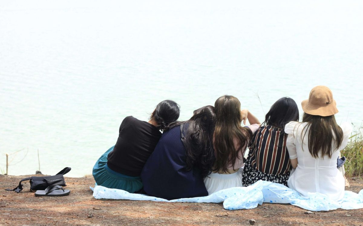 5 girls went for there unexpected adventurous journey and thet are sitting and resting together and they are very happy there.